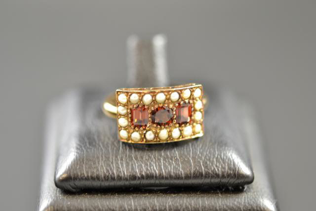 A 9ct gold ring set with garnets and seed pearls, size K 1/2 - approx gross weight 2.8g