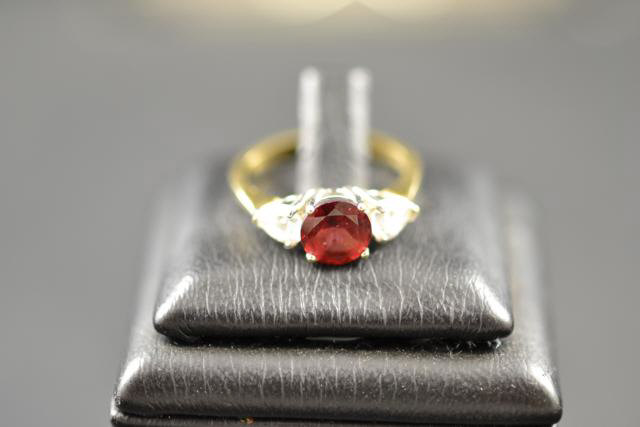 A 9ct gold ruby and cubic zirconia ring, size L 1/2 approx gross weight 3g