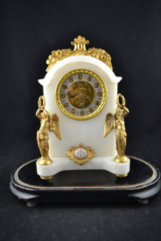 A 19th century French alabaster mantle clock, gilt figural mounts, visible escapement - H32cm, under