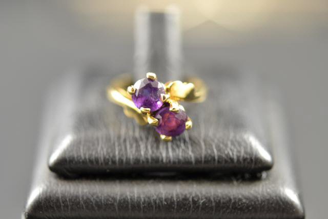 A 9ct gold set with two amethysts, size G - approx gross weight 1.8g