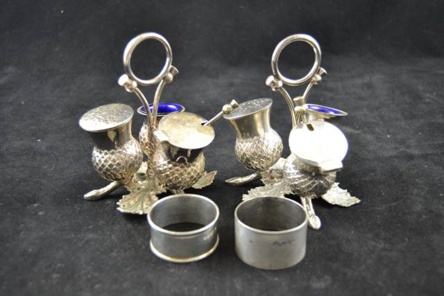 A pair of Scottish silver plated condiment sets on leaf stands, H12cm, together with two silver