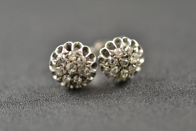 A pair of 18ct white gold earrings, each set with eight diamonds - approx total gross weight 3g