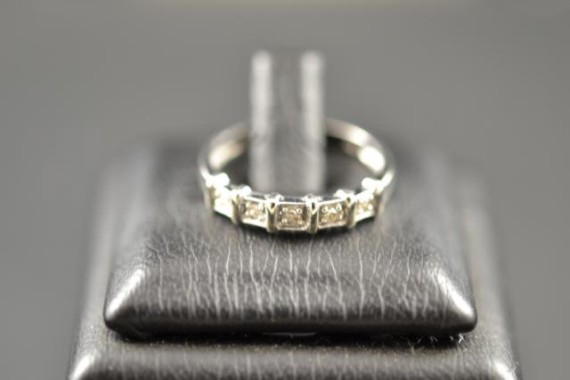 A 9ct white gold ring set with five diamonds, size K 1/2 - approx gross weight 1.7g