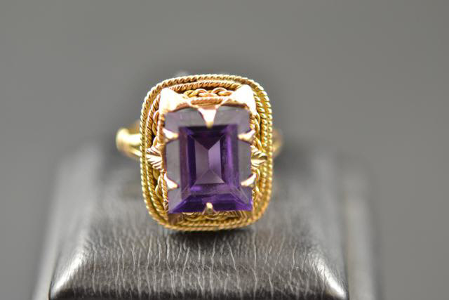 A yellow metal ring set with square cut amethyst, size N 1/2 - approx gross weight 5.1g