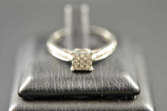 A 9ct white gold ring with diamonds in a square setting, size N 1/2 - approx gross weight 1.9g