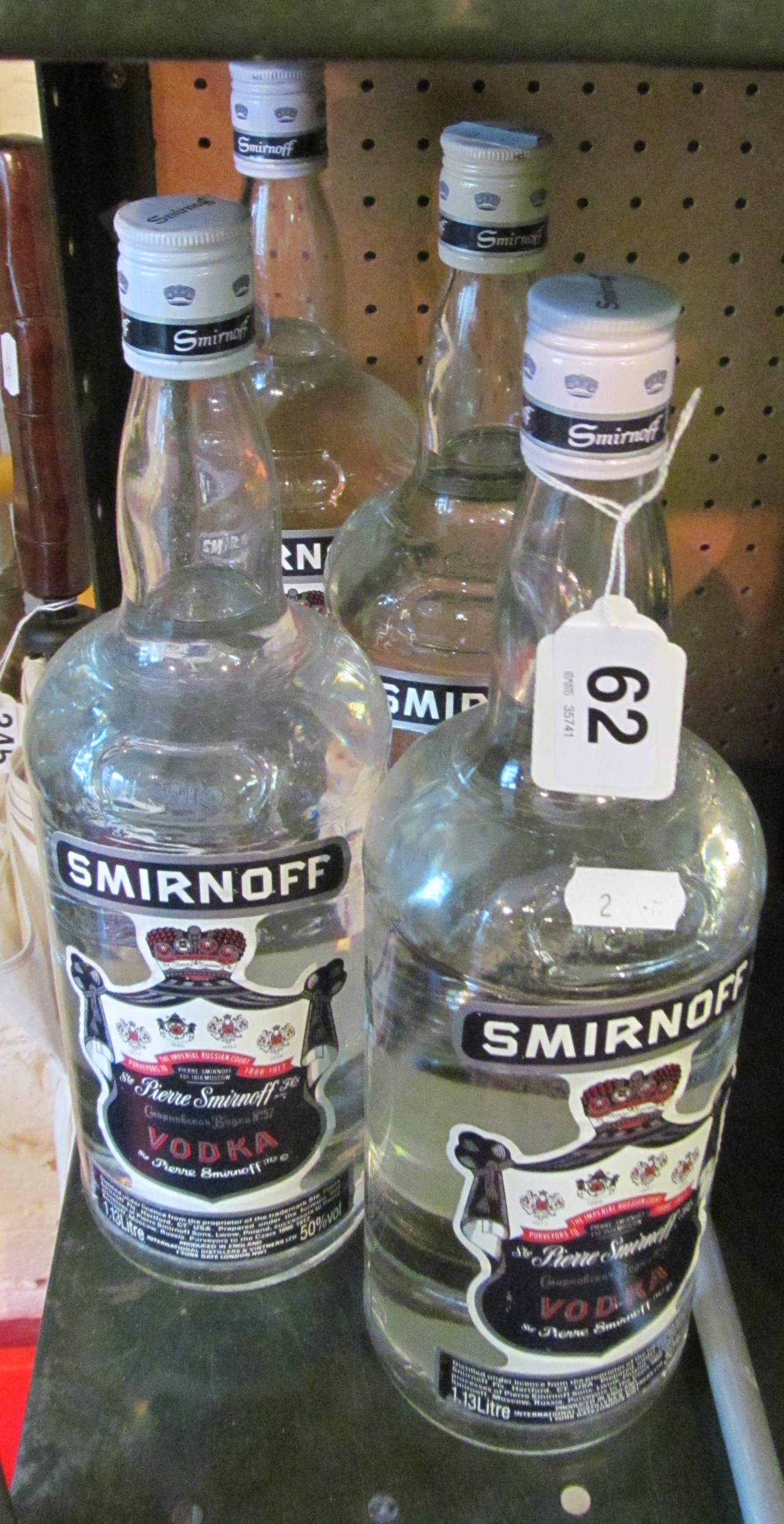 Four bottles of Smirnoff.