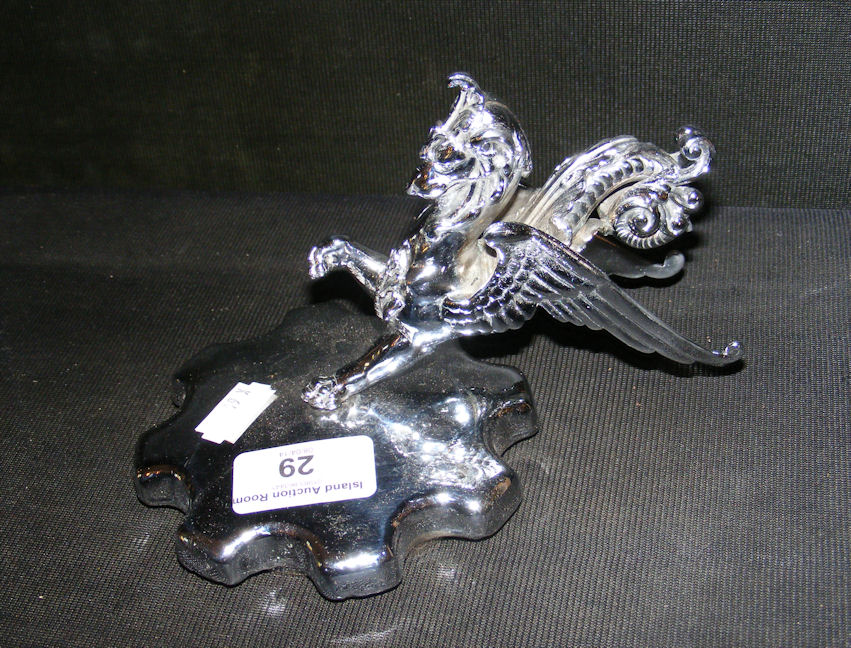 An old chromium plated motor car radiator cap mounted with Griffin mascot.