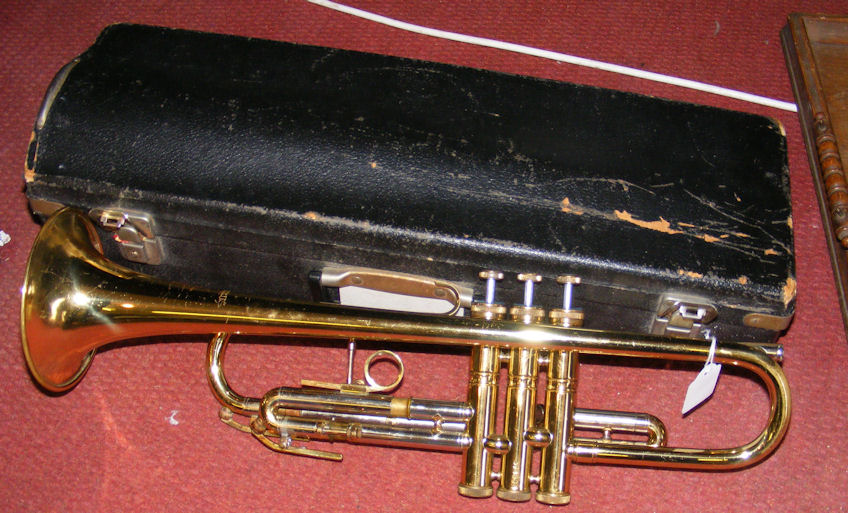 A brass trumpet stamped “York” - complete with fitted carrying case.