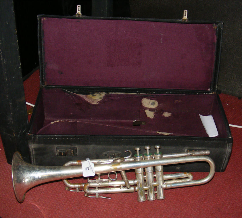 A Beeson “Stratford” plated trumpet with fitted carrying case.