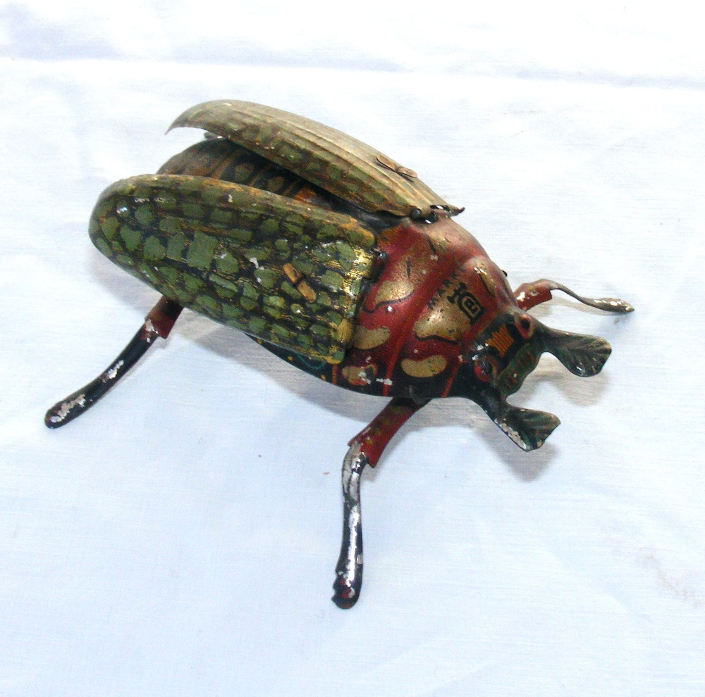 A Lehmann German tin plate crawling beetle wind up toy dated 1895.   CONDITION REPORT:  In working