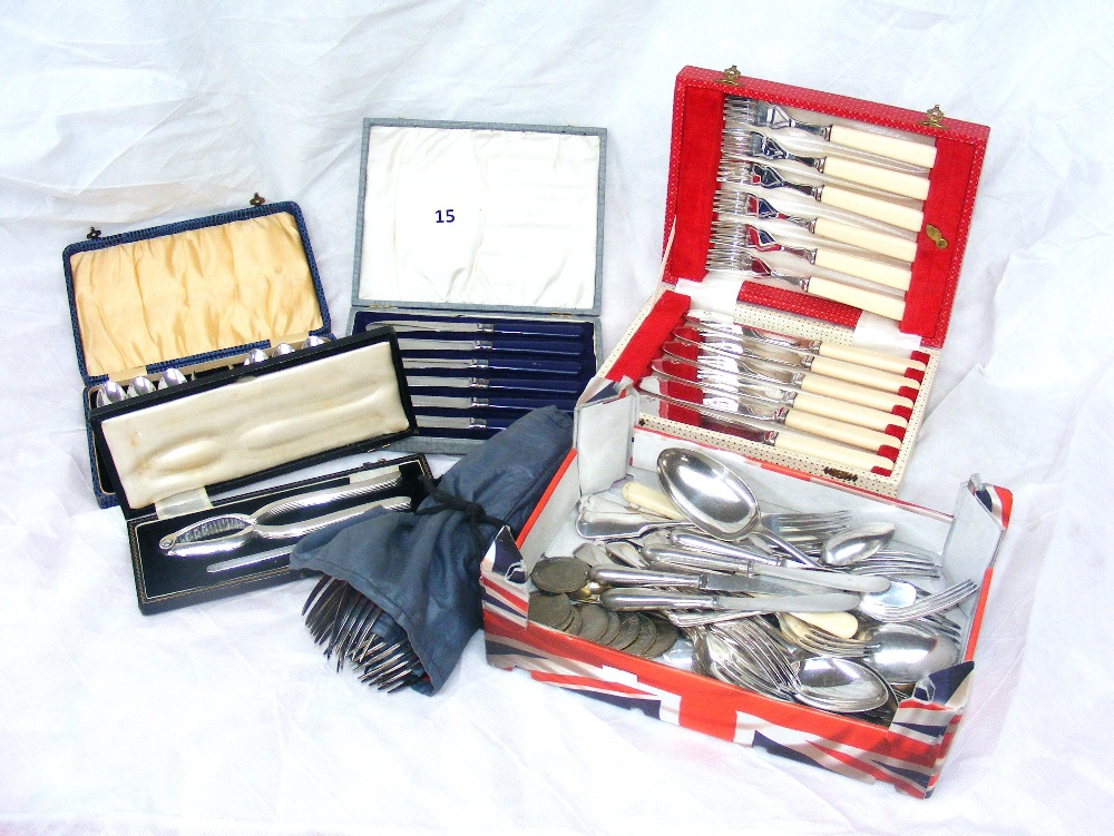 Three cased cutlery sets, a cased nutcracker set, a box of assorted silver plated cutlery, five