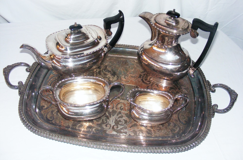 A silver plated four piece tea service on tray.