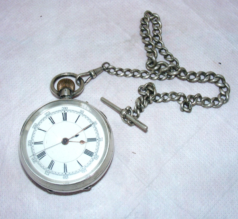 A silver plated cased chronometer of large proportions with a sterling silver albert chain.