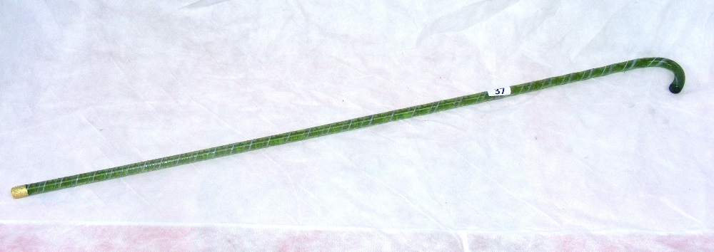 An antique Victorian Nailsea style glass walking cane measuring 99cm long.   CONDITION REPORT:  No