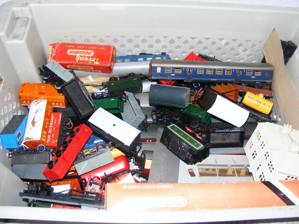 A box of 00 Gauge carriages, wagons etc.