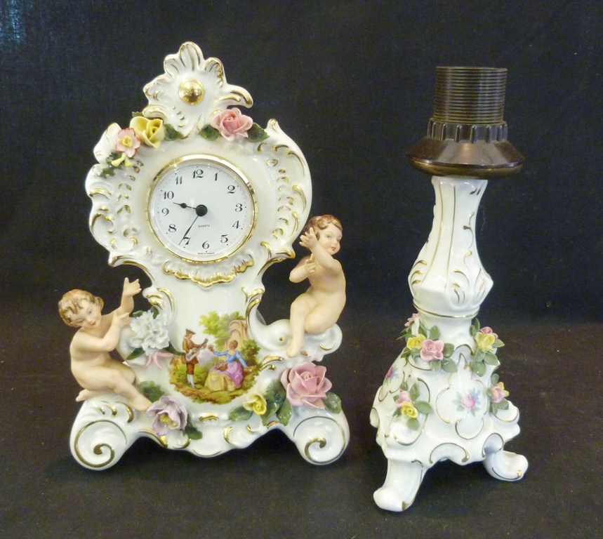 A Dresden Porcelain Table Clock, with putti surmount together with a similar Dresden table lamp