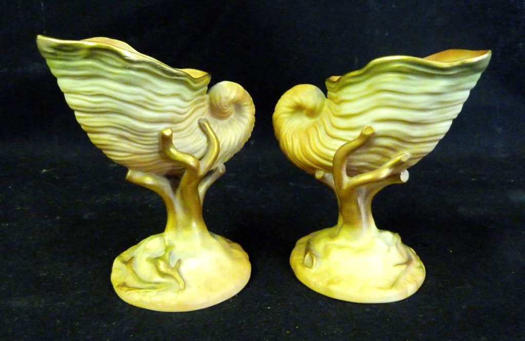 A Pair of Royal Worcester Blush Ivory Conch Shell Vases, highlighted with gilt puce mark, 10cms tall