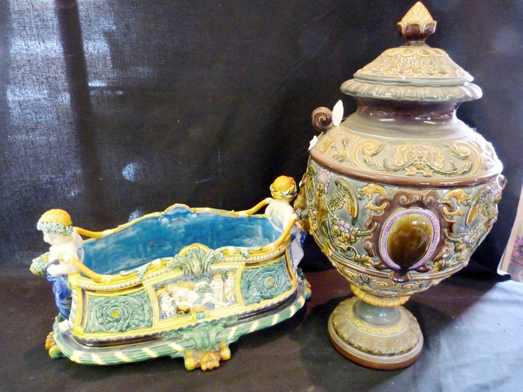 A Large Majolica Jardiniere with figural supports and scroll feet, together with a similar