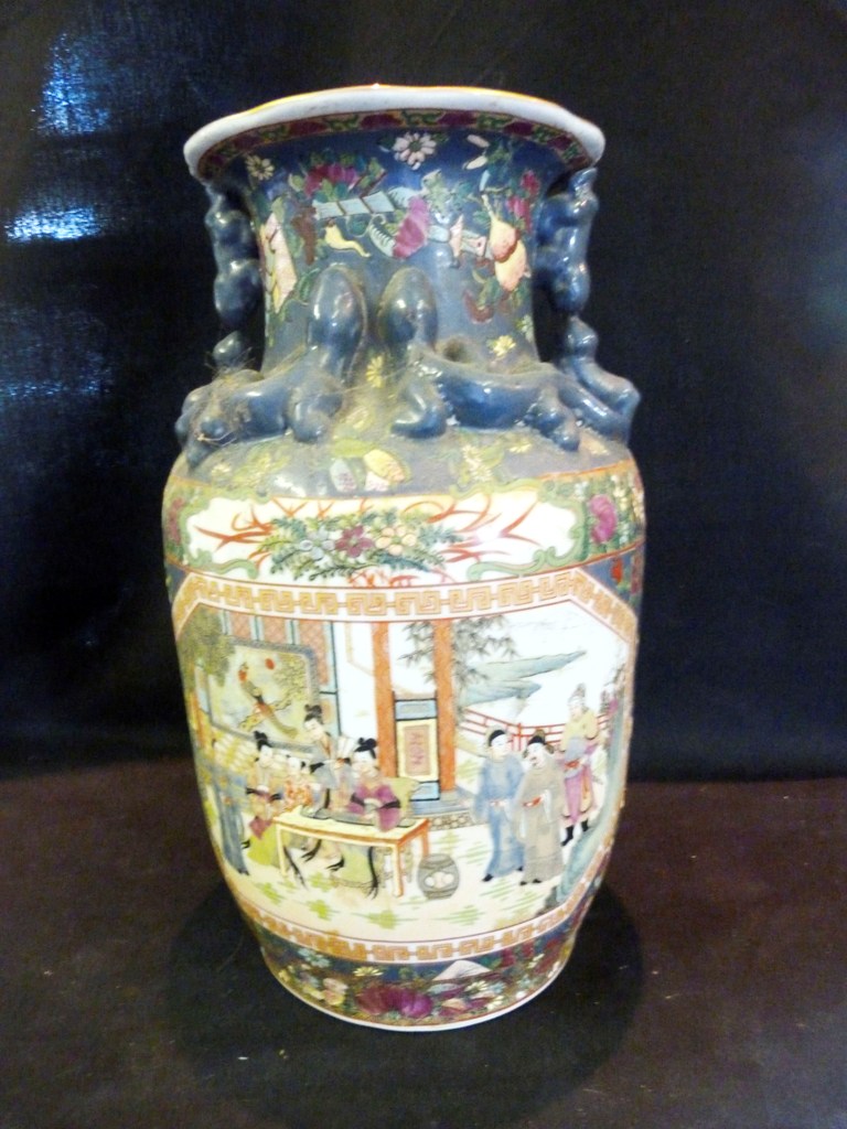 A Chinese Porcelain Vase, decorated with figures within a landscape and polychrome enamels