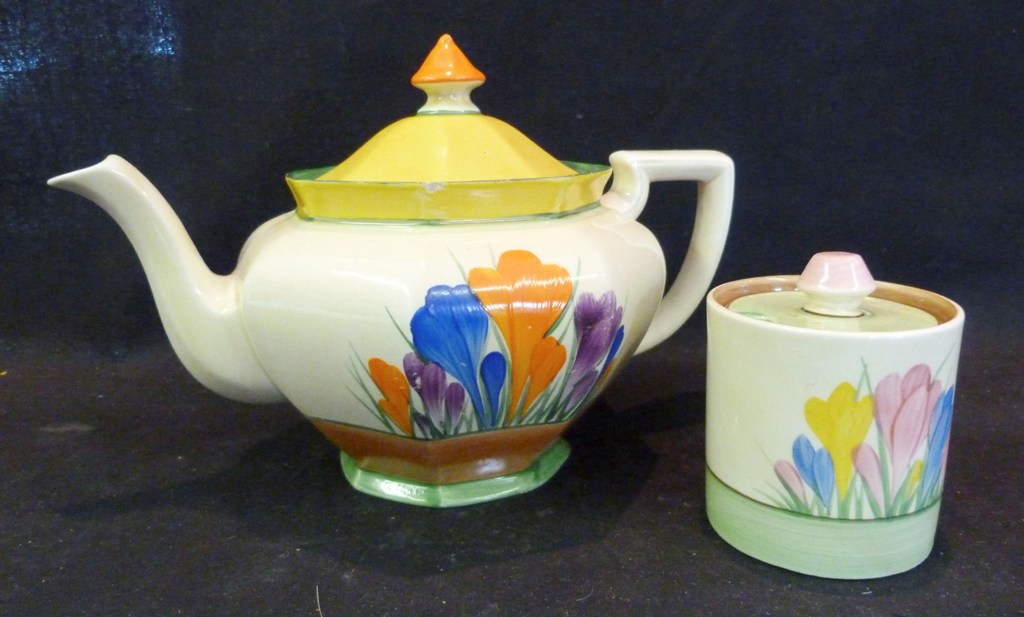 A Clarice Cliff Bizarre Crocus Pattern Teapot, together with another similar crocus pattern preserve