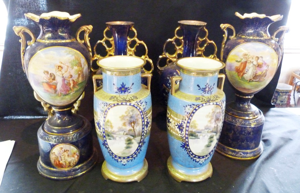 A Pair of Noritake Porcelain Two Handled Vases, each decorated with a reserve depicting a river