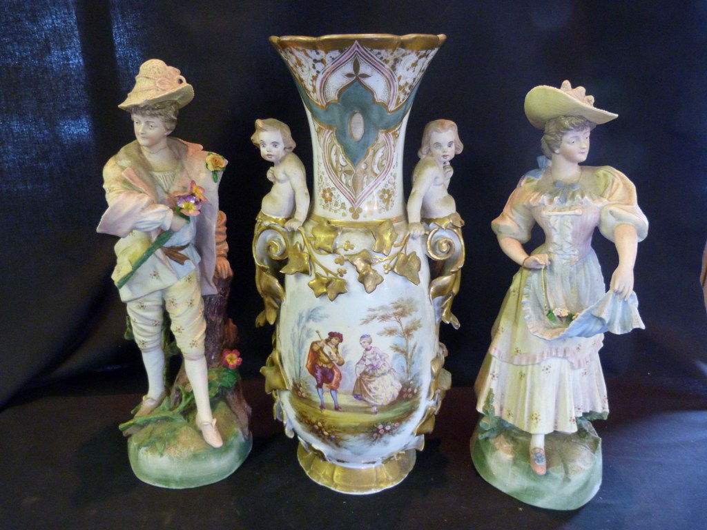 A Large Victorian Porcelain Vase, with figural mounts, together with a pair of Victorian bisque