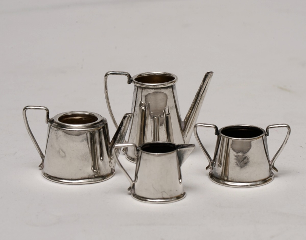 a HM silver dolls tea set  (4 pieces) teapot lid missing) Birmingham 1956-57 31 gms