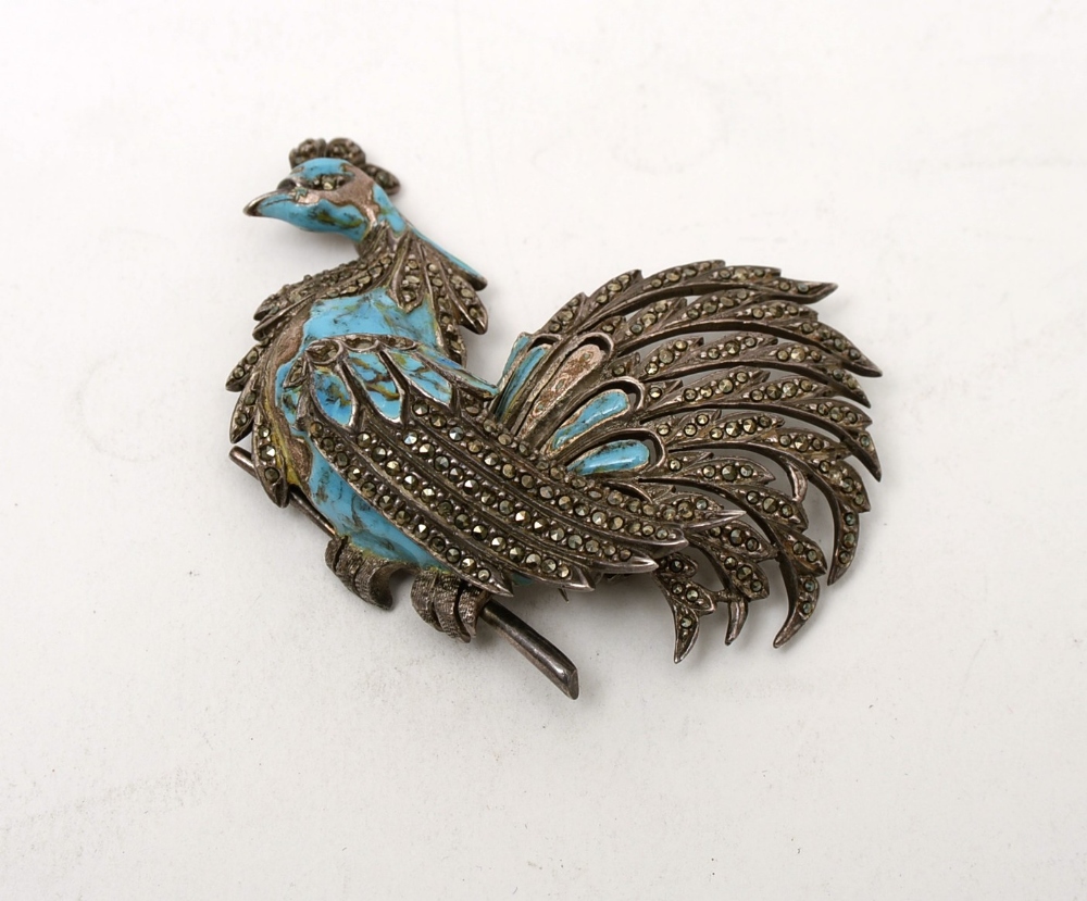 silver and blue stone bird brooch