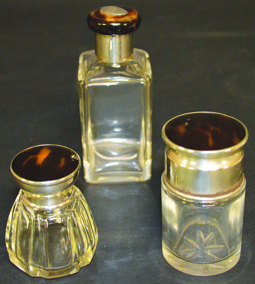 THREE SILVER AND TORTOISESHELL TOPPED SCENT BOTTLES.