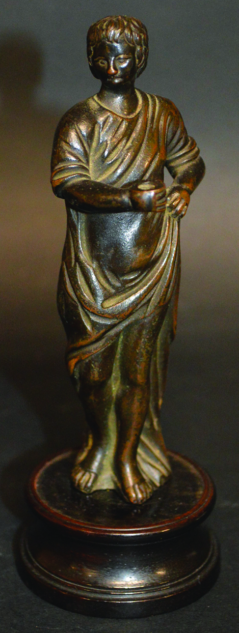 A SMALL CLASSICAL FULL LENGTH BRONZE FIGURE, probably Renaissance, on a circular base 5.25ins high.