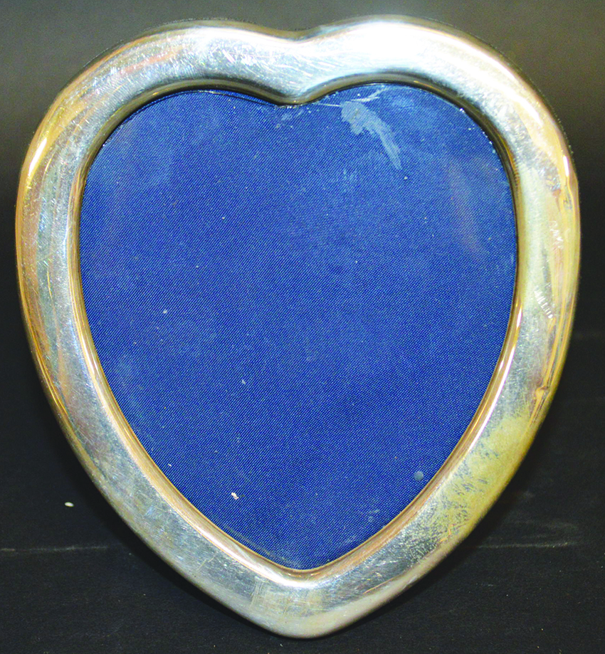 A SILVER HEART SHAPED PHOTOGRAPH FRAME. 5.5ins x 5ins.