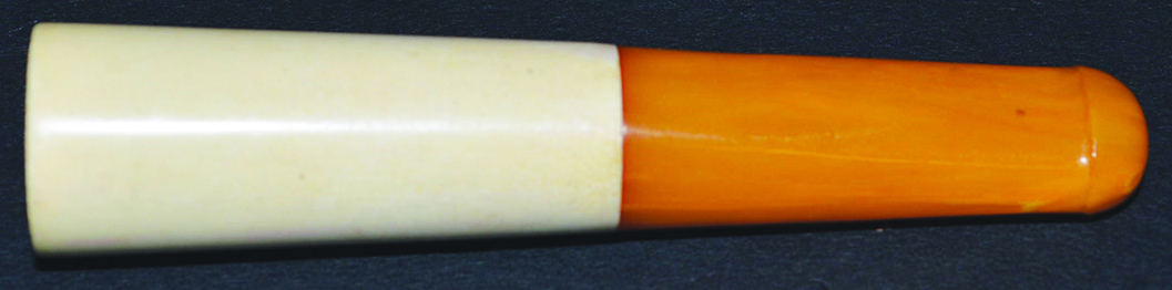 AN IVORY AND AMBER CIGARETTE HOLDER.