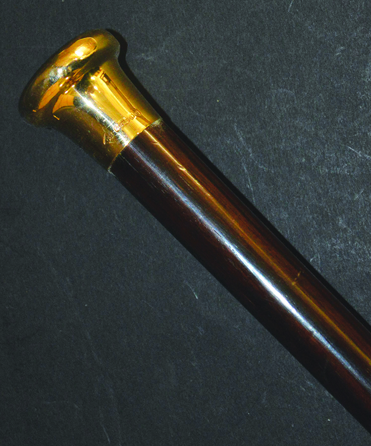 A GOLD TOPPED ROSEWOOD CANE with plain gold top, ENGLISH, CIRCA. 1900 35ins long.