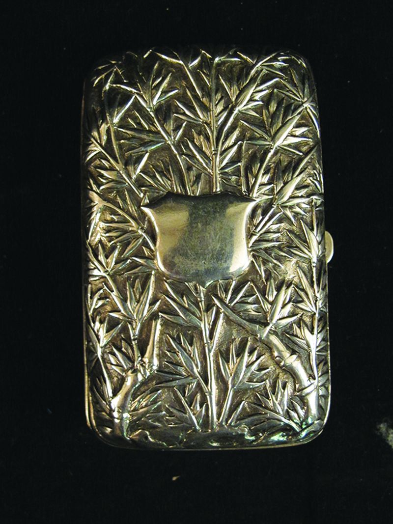 A CHINESE SILVER CIGARETTE OR CHEROOT CASE, circa 1900, unmarked, embossed to both sides with