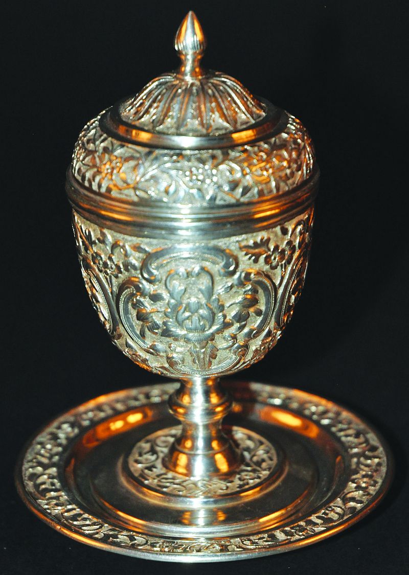 A 20TH CENTURY CHINESE SILVER-METAL CUP & STAND, made for the Parsi market in India, 5.1in high