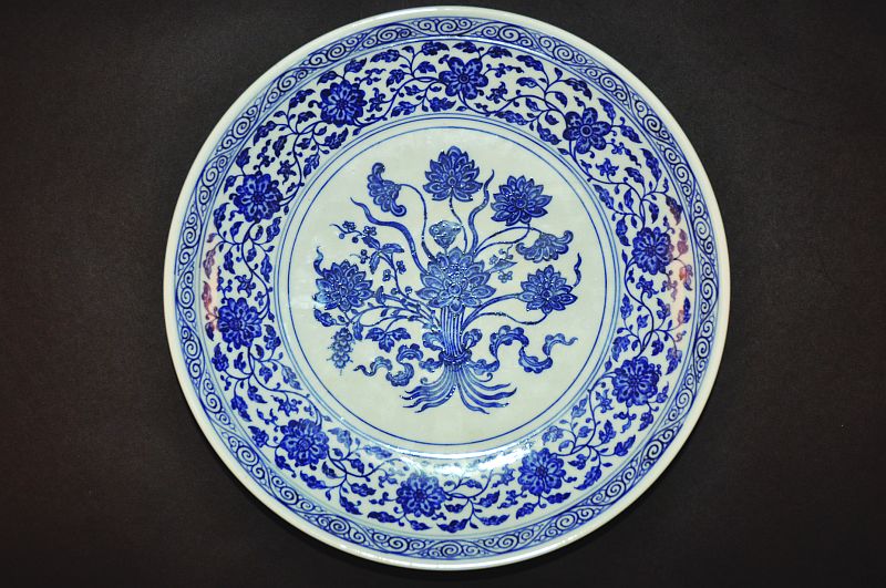 A CHINESE MING-STYLE BLUE & WHITE PORCELAIN DISH, the base with a six-character Yongzheng mark, 11.