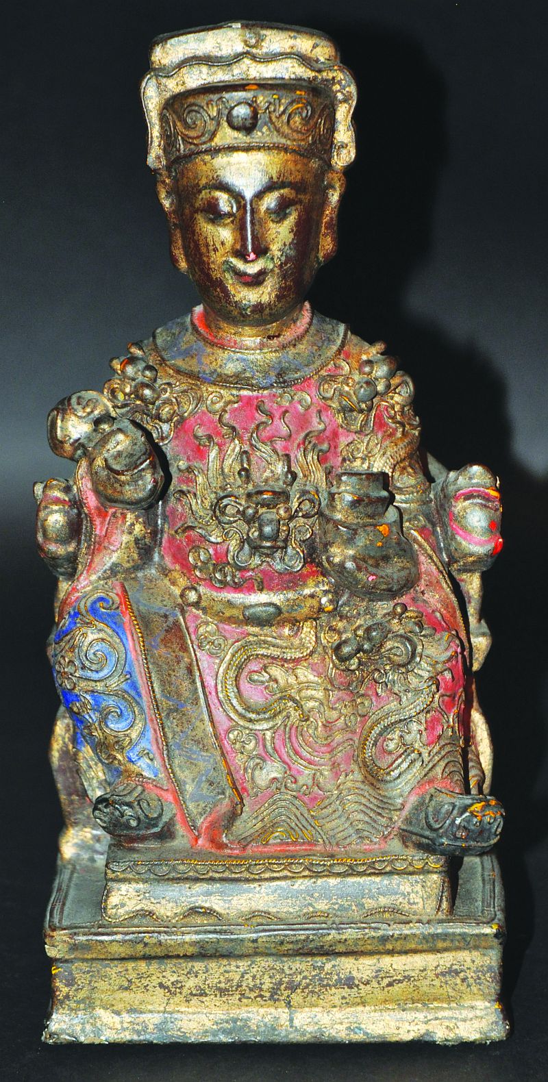 A 17TH-18TH CENTURY CHINESE LACQUERED, GILDED & CARVED WOOD FIGURE OF AN EMPEROR, seated on a dragon