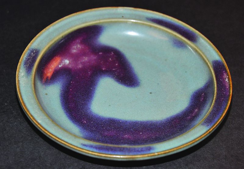 A PURPLE-SPLASHED JUNYAO TYPE PORCELAIN DISH, the purple reserved on a bluish ground, 6.75in