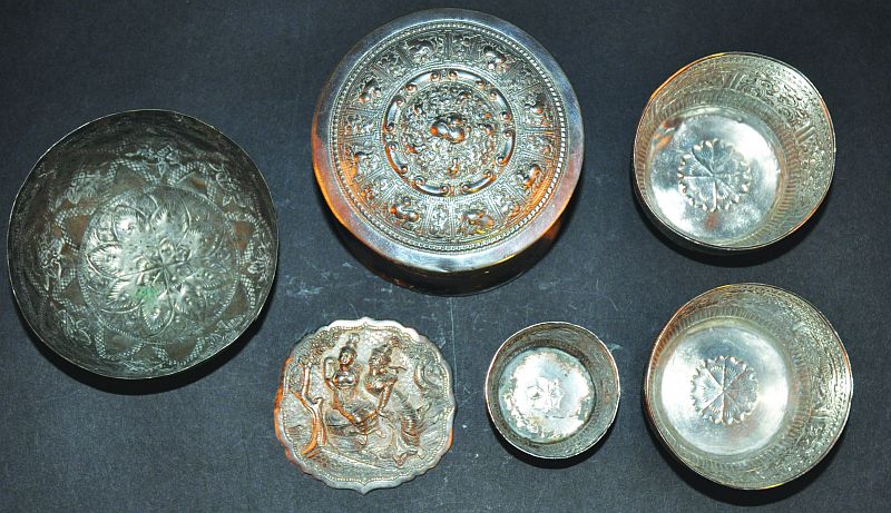 FOUR ROUNDED SILVER-METAL BOWLS, together with a betel box & cover and a buckle element, 19th &