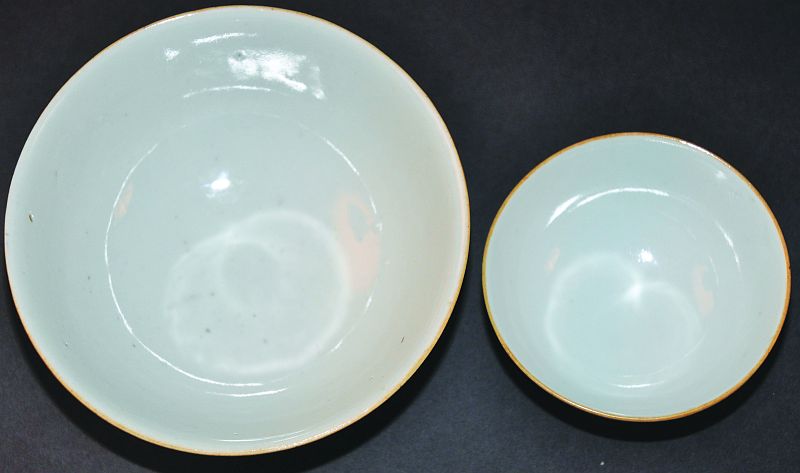 A 19TH CENTURY CHINESE POWDER-BLUE PORCELAIN BOWL, the exterior sides with traces of gilded dragon