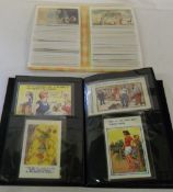 2 postcard albums containing mainly humorous and Bamford cards