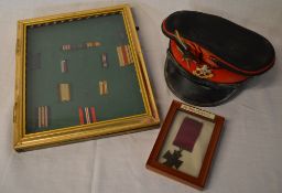 Military hat with badge and framed ribbon, badge & medal