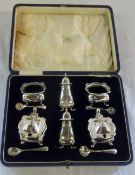 Silver cruet set by Mappin & Webb consisting of 2 salts with spoons, 2 pepper, 2 mustard pots with 2