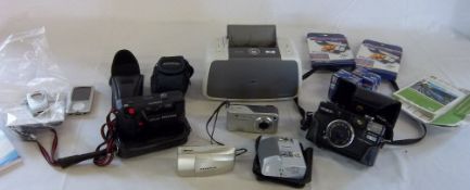 Box of various cameras and camera equipment