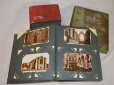 2 albums of postcards (mainly churches) & an album of comical cards