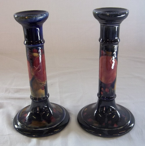 Pr of Moorcroft candlesticks signed in green at base with impressed burslem mark h 20.5 cm