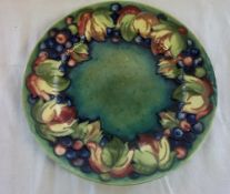 Moorcroft leaf and berry plate signed in green at base d 21 cm