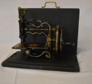 James G Weir's London miniature sewing machine with case