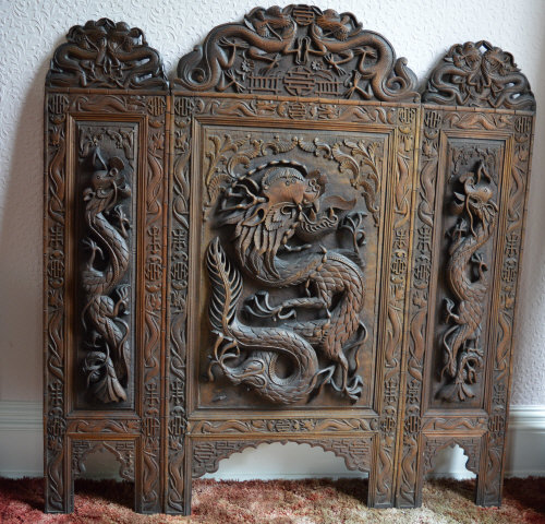 Oriental 3 panel folding screen with heavily carved dragon motifs 107 cm x 100 cm