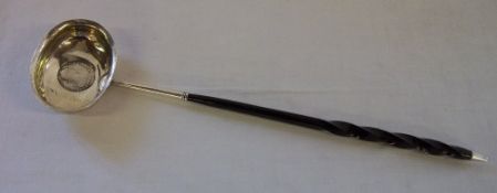 Tested as silver punch ladle inset with a Carolus III 1778 coin with whale bone handle